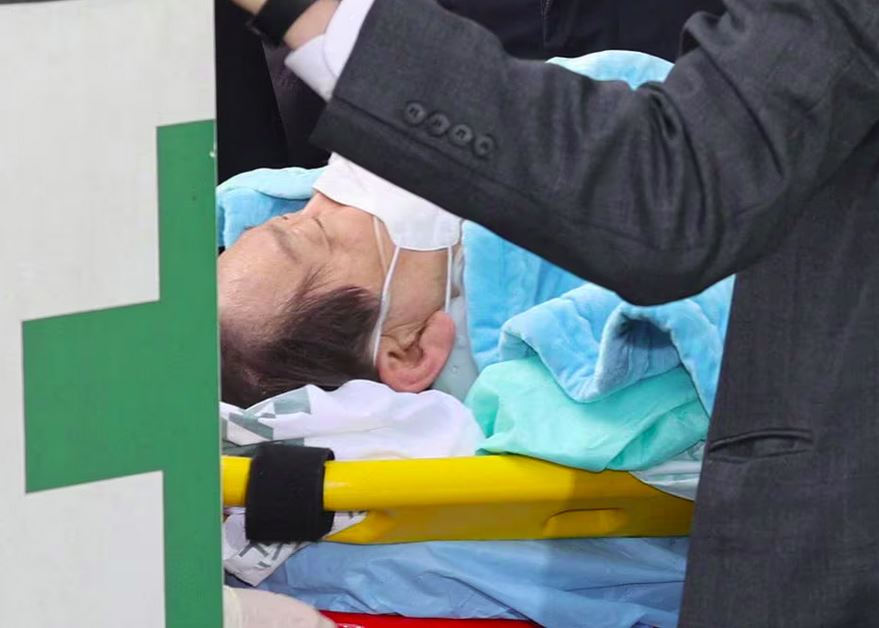 On January 2, 2024, in Seoul, South Korea, opposition Democratic Party leader Lee Jae-myung enters on a stretcher at Seoul National University hospital following a neck knife wound sustained during a visit to Busan from an unnamed individual.