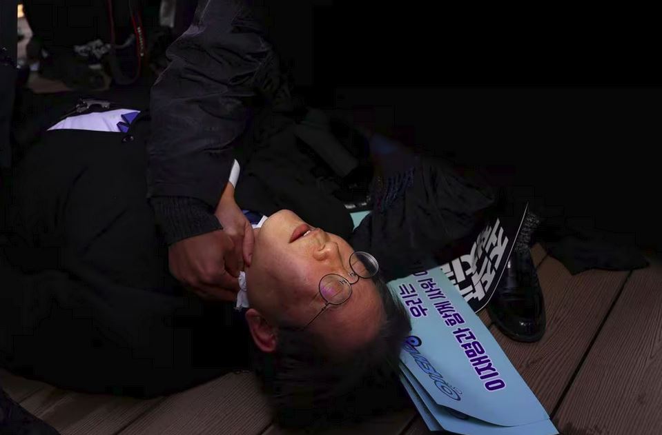 South Korea's opposition Democratic Party leader Lee Jae-myung arrives on a stretcher at Seoul National University hospital after being stabbed in the neck by an unidentified man during his visit to Busan, in Seoul, South Korea, January 2, 2024.