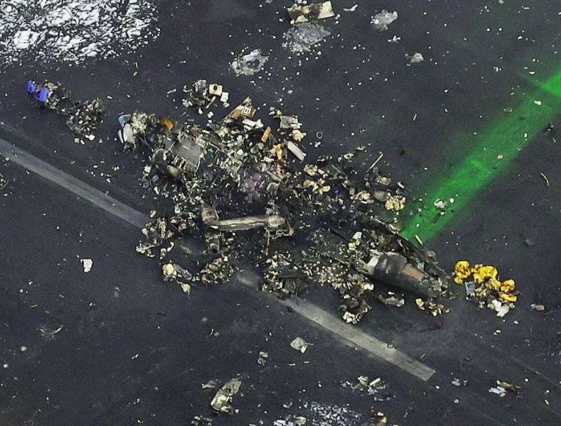 An aerial view shows burnt Japan Airlines' (JAL) Airbus A350 plane after a collision with a Japan Coast Guard aircraft at Haneda International Airport in Tokyo,