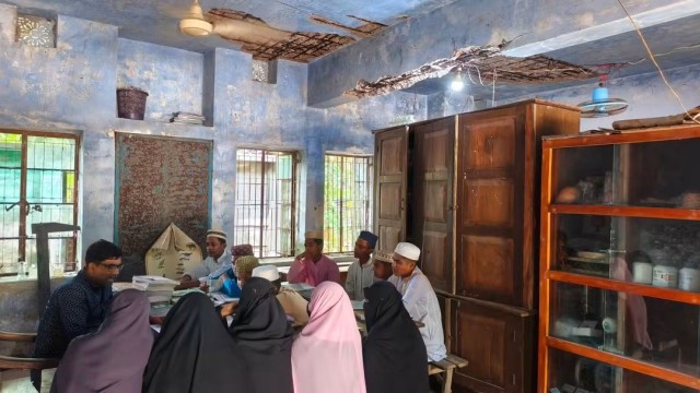 “Classes Under Plastic Sheets at Risky Madrasa Building in Rajapur”