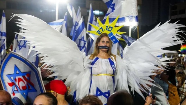 Anti-Government Protest in Tel Aviv as Iran Issues Warning to Israel