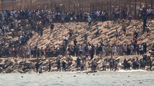 Spain Faces Migrant Surge as Tens of Thousands Enter Ceuta from Morocco